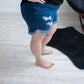 DISTRESSED STRETCH JEAN SHORTS